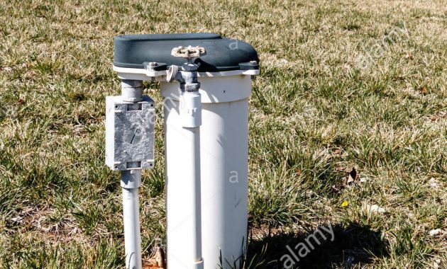 A Water Meter With A Faucet In A Neighborhood Yard Usa Stock Photo within measurements 866 X 1390