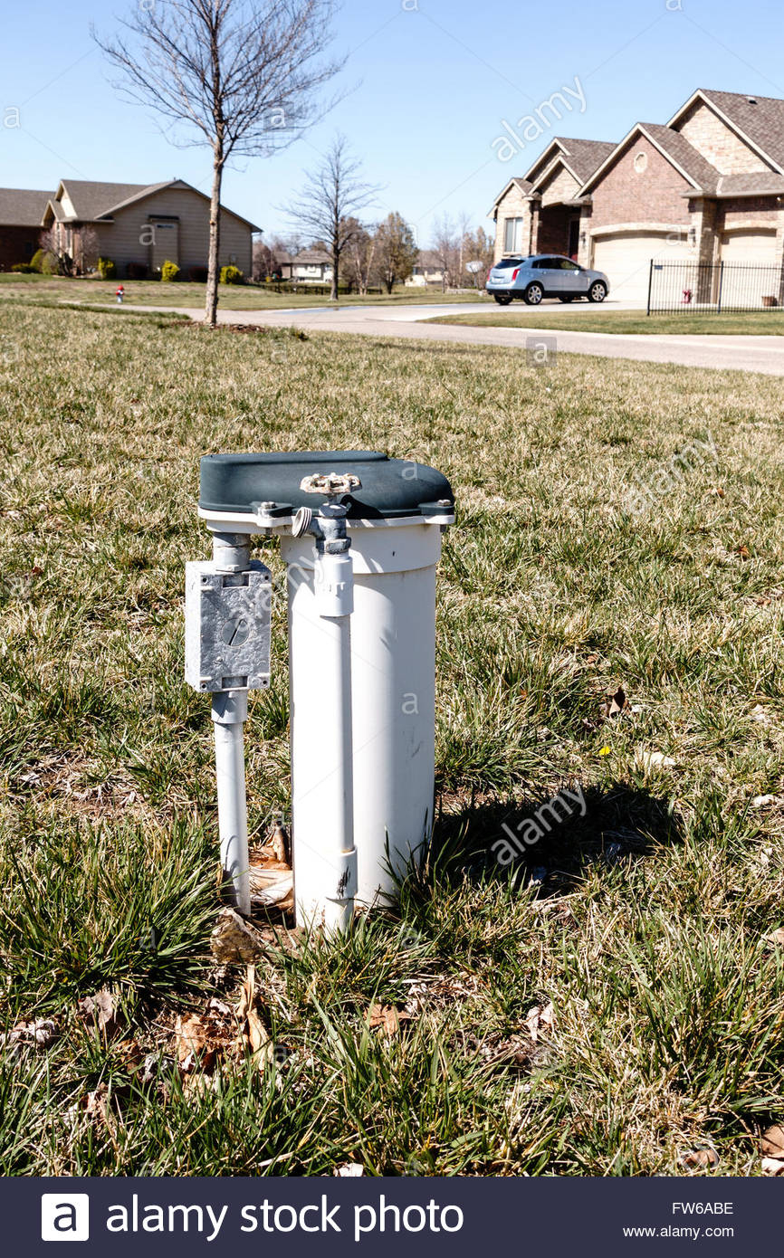 A Water Meter With A Faucet In A Neighborhood Yard Usa Stock Photo within measurements 866 X 1390