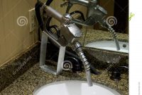 Gas Pump Nozzle As Water Faucet Stock Photo Image Of Bathroom pertaining to measurements 955 X 1300