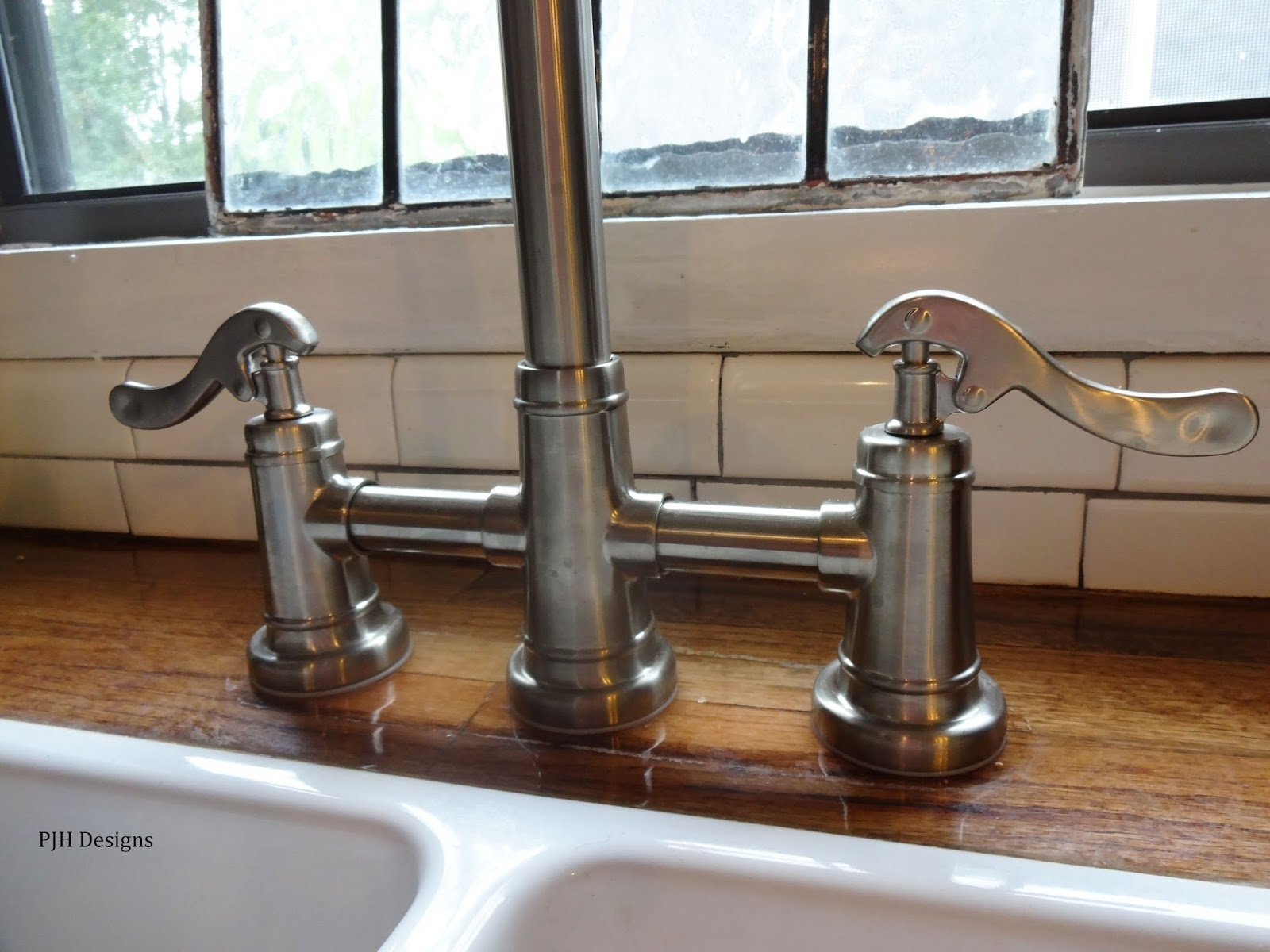 vintage look 2 faucets kitchen sink