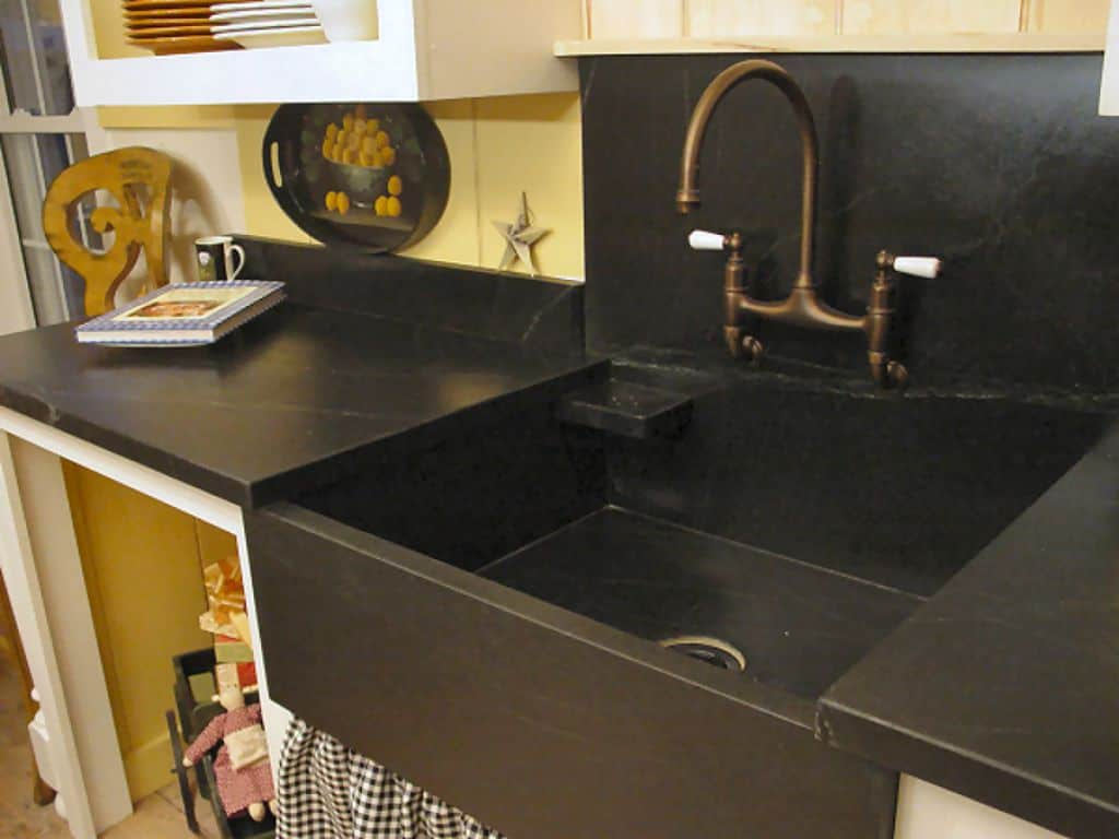 Traditional Kitchen Designed With Black Countertops And Stone Sink with sizing 1024 X 768