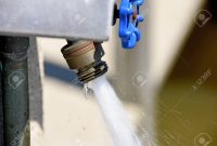 Water Spraying Out Of Outdoor Faucet Stock Photo Picture And inside proportions 1300 X 867