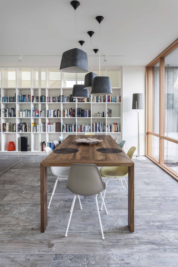 A Ligne Roset Eaton Dining Table Surrounded Eames Chairs in proportions 750 X 1125