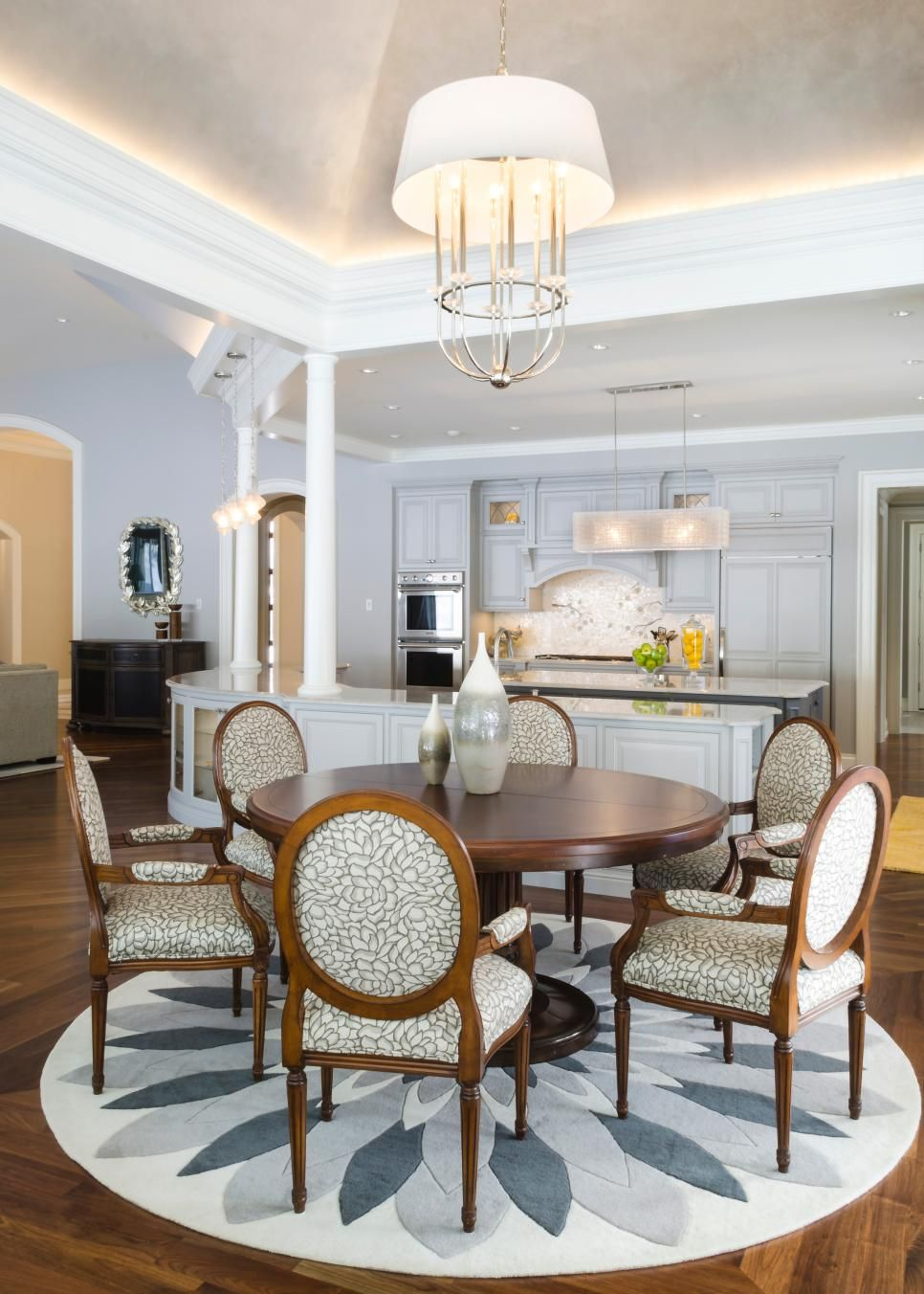 A Stunning Round Dining Room Table Paired With A Graphic inside sizing 966 X 1352