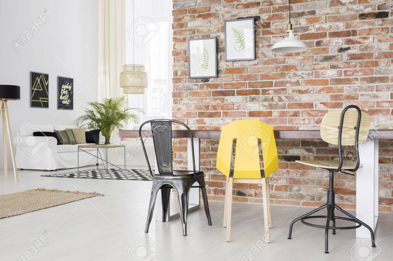 Modern Apartment With Brick Wall Dining Table Chair And Sofa intended for size 1300 X 866